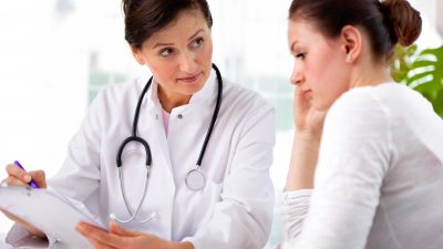 Doctor with female patient